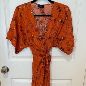 VICI DARK ORANGE AND FLORAL LOW CUT MAXI WRAP DRESS